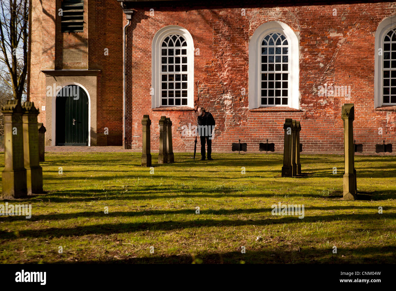 church Friedenskirche and cemetery in Leer , East Frisia, Lower Saxony, Germany Stock Photo