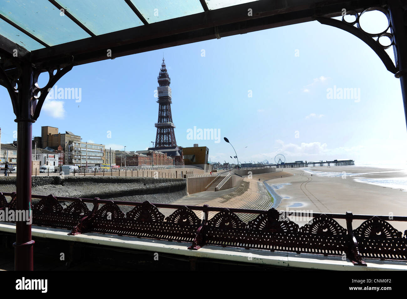Blackpool Tower framed through the ironwork of the North Pier Lancashire Uk Stock Photo