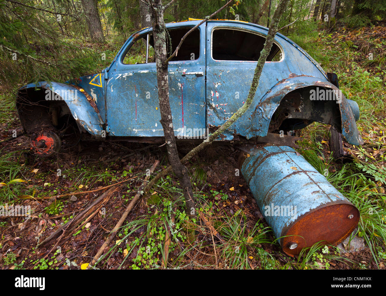 Volkswagen beetle wreck in the forest , Finland Stock Photo
