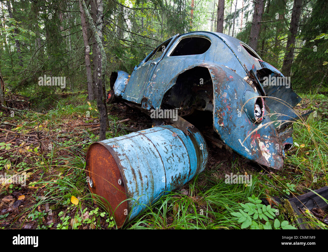 Volkswagen beetle wreck in the forest , Finland Stock Photo