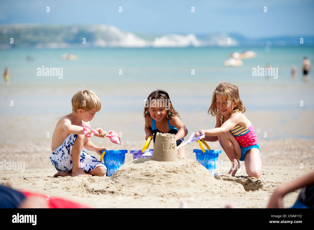 Three children on Weymouth Beach, Dorset Stock Photo