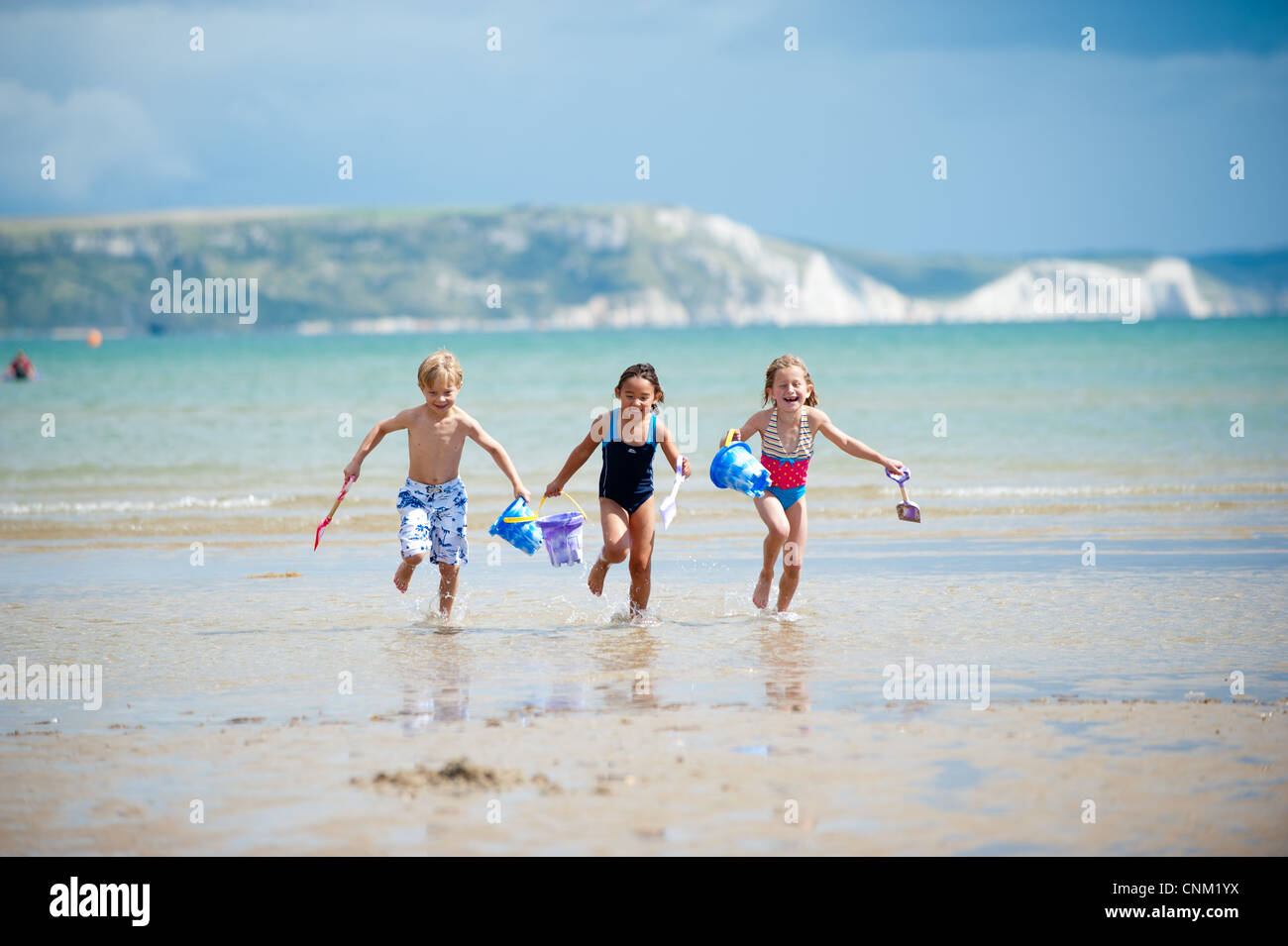Three children on Weymouth Beach, Dorset Stock Photo