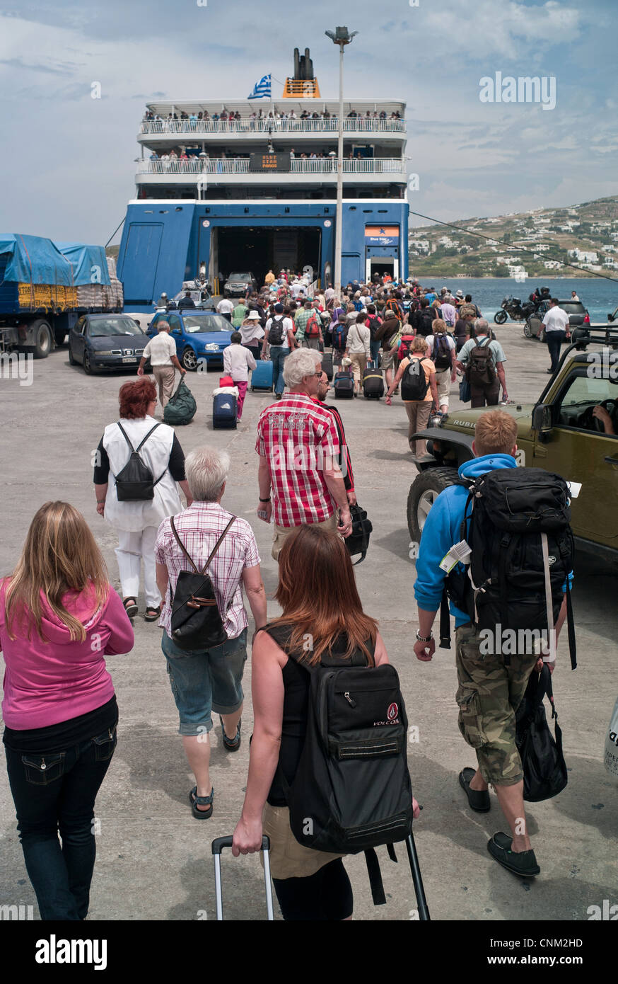 Tourists board a Blue Star ferry on Paros in the Cyclades Stock Photo