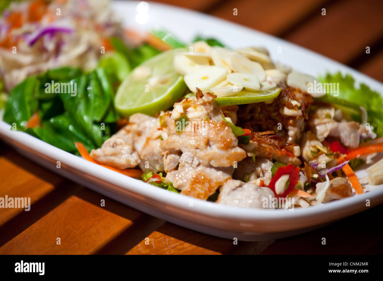Thai cuisine, Chicken garlic dish in Phuket, Thailand Stock Photo