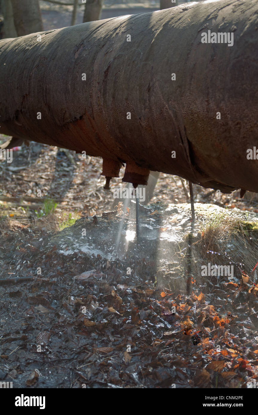 water leaking from the damaged pipeline Stock Photo Alamy