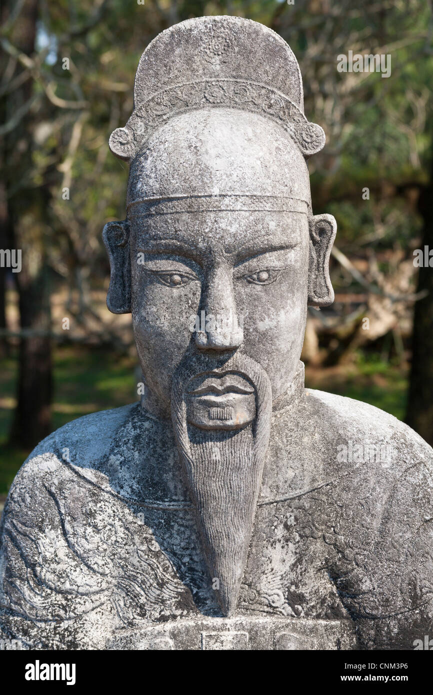 A stone statue of a man at the tomb of Emperor Tu Duc, near Hue