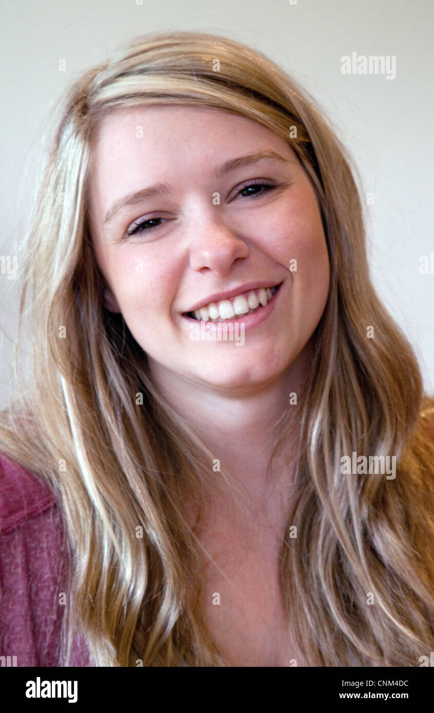 Beautiful teenager; Smiling teen girl; Head and shoulders portrait of a ...