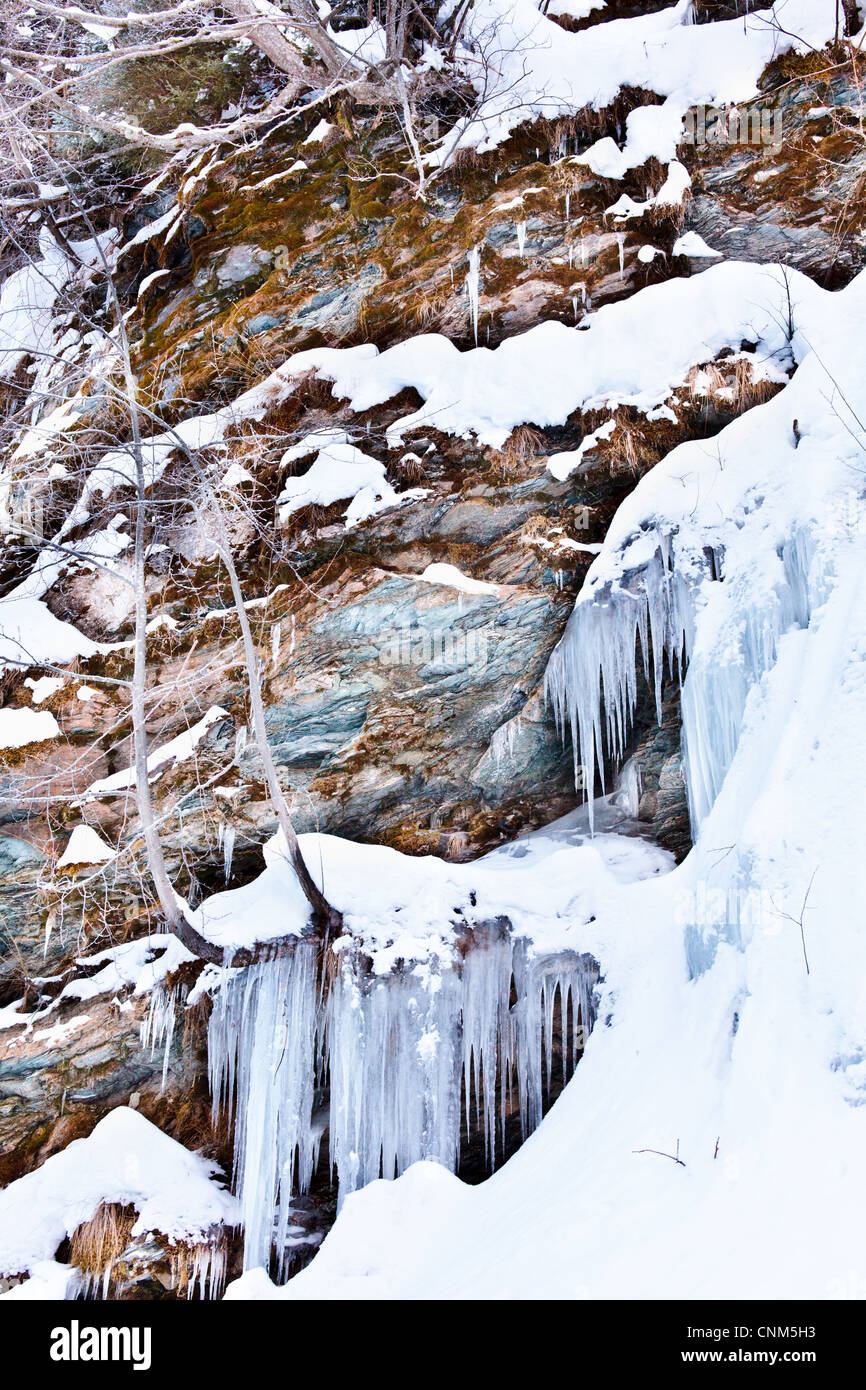 Huge icicles formed in a waterfall on a mountain Stock Photo Alamy