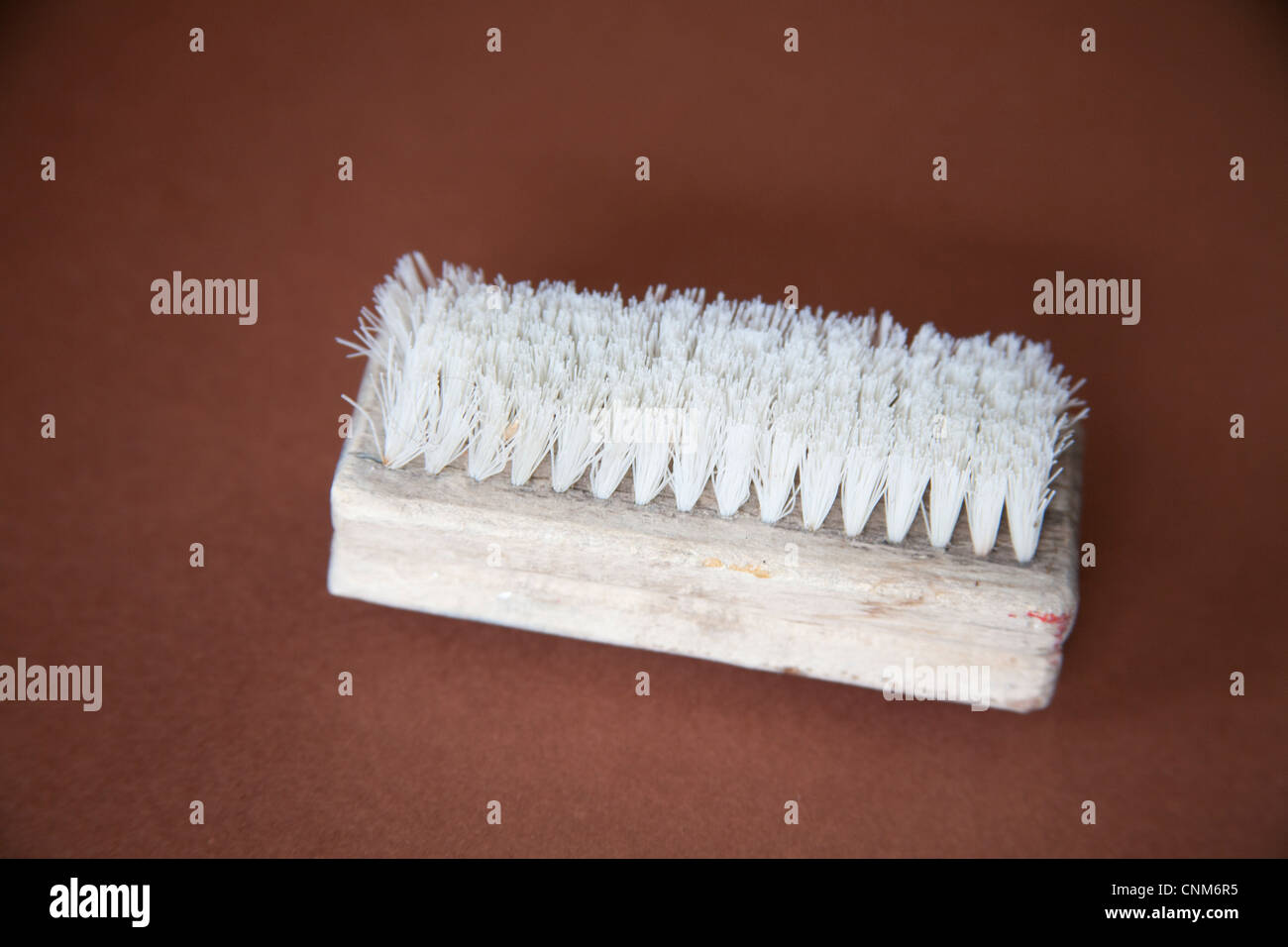 Old wooden nail brush Stock Photo