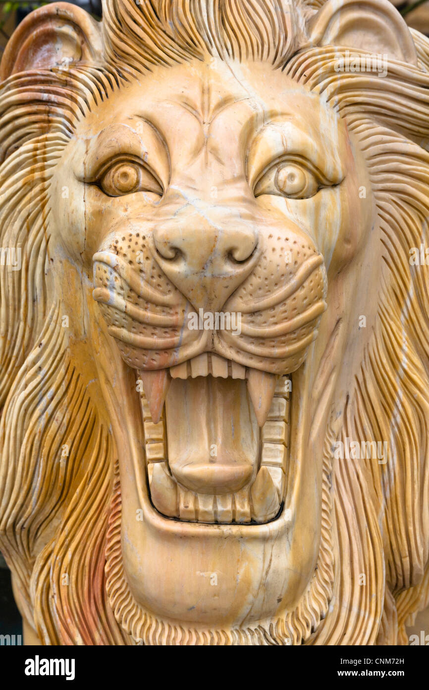 Stone carving of a growling male lion, Hai Duong, Vietnam Stock Photo