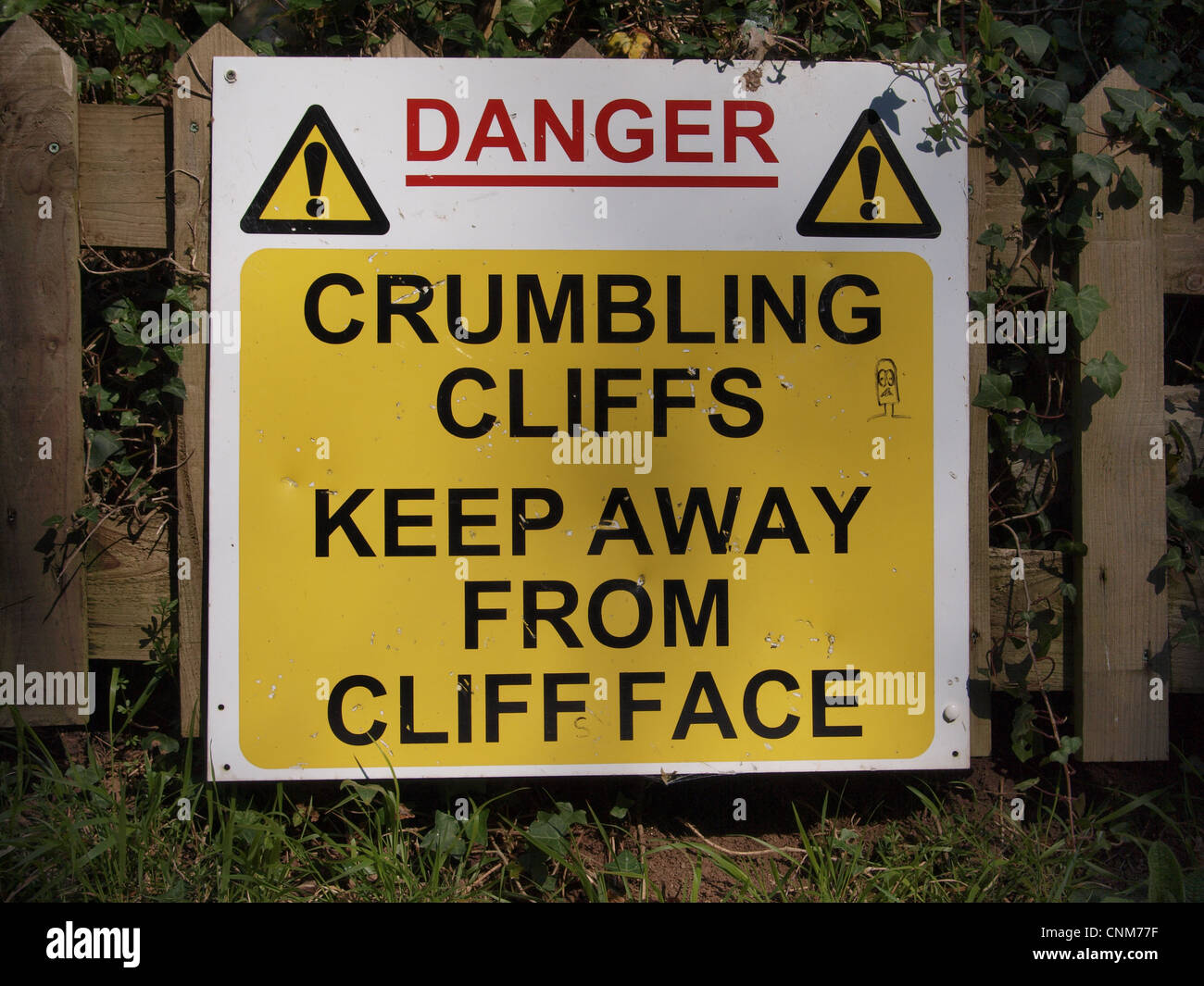 Danger crumbling cliff warning sign. Somerset. UK Stock Photo - Alamy