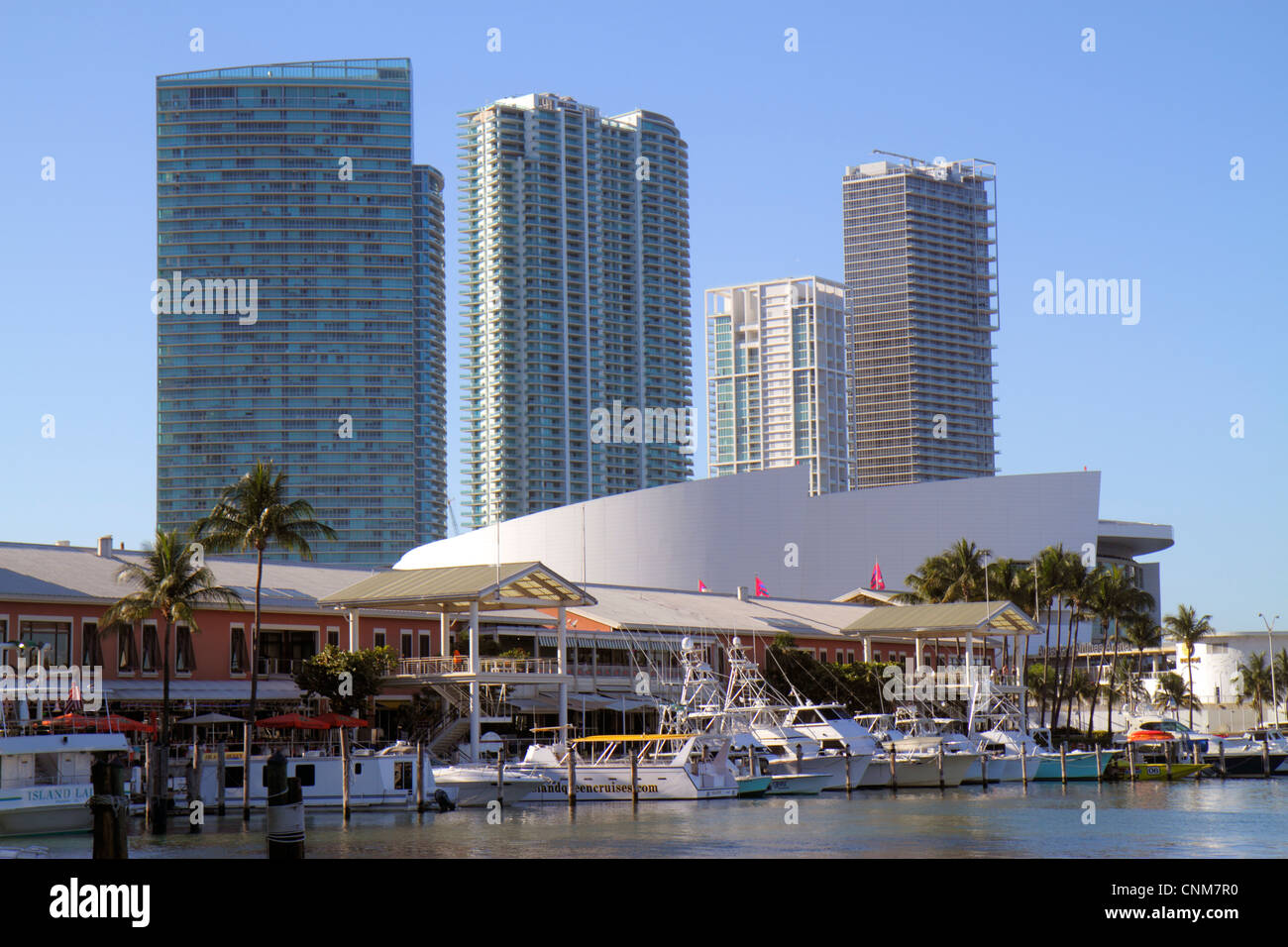 Miami Florida,Bayside Marketplace,Marina,Biscayne Bay,charter fishing boats,high rise,condominiums,American Airlines Arena,FL120311088 Stock Photo