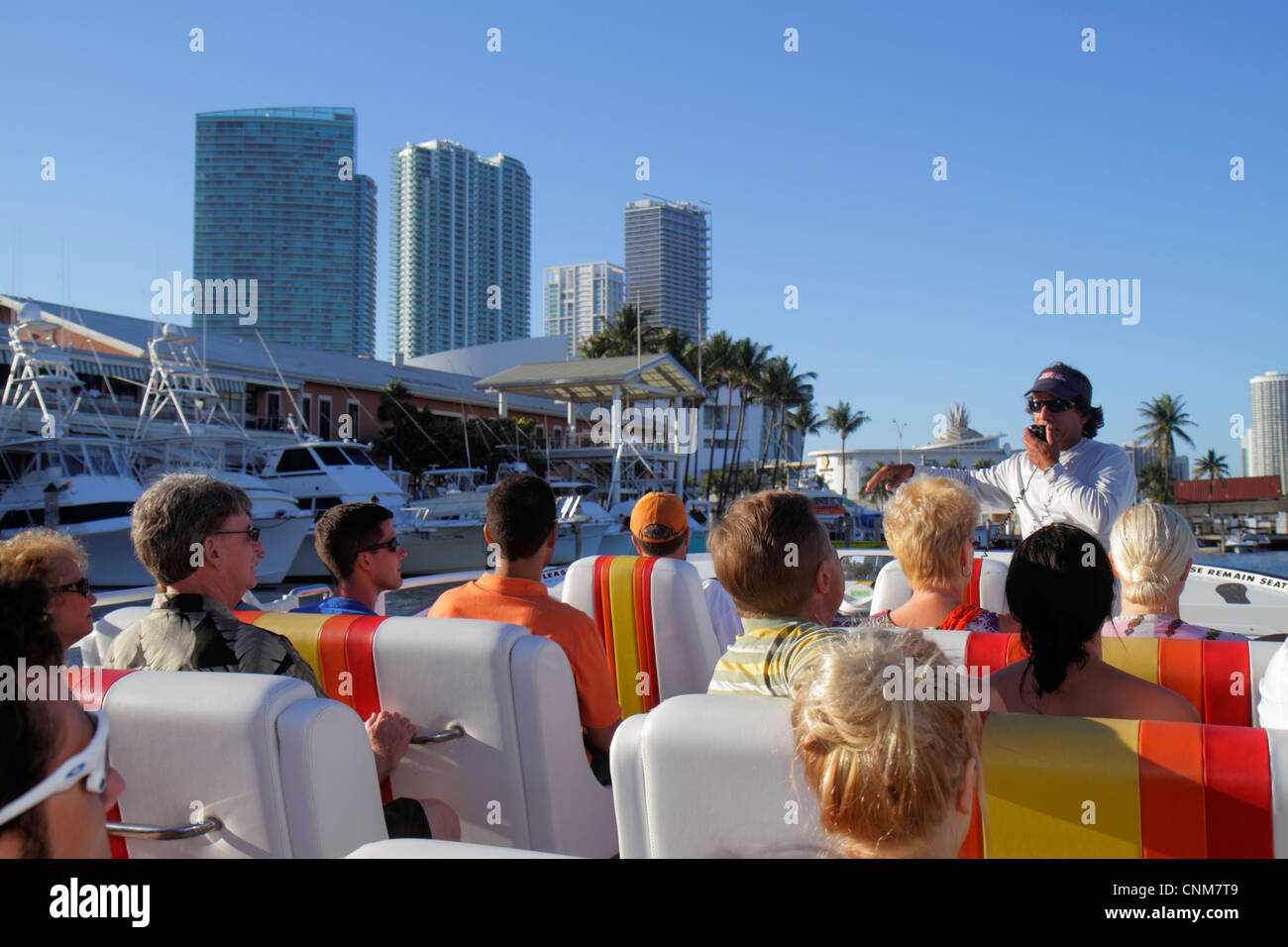 Miami Florida,Bayside Marketplace,Marina,Biscayne Bay,Thriller Speedboat tour,passenger passengers rider riders,guide,speaking,FL120311093 Stock Photo