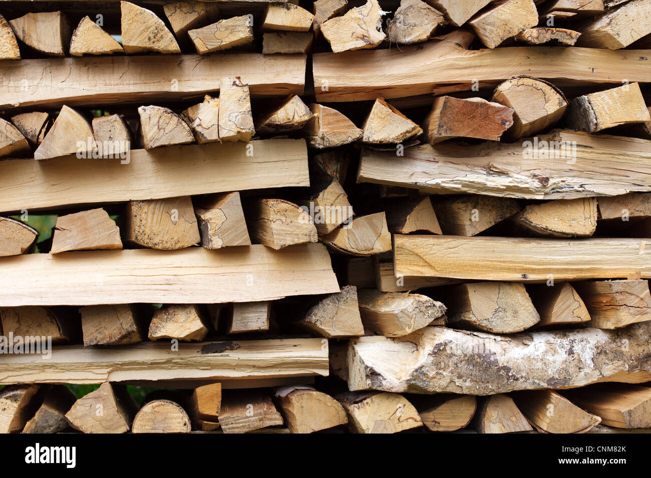 Stacked chopped wood for the winter or construction Stock Photo - Alamy