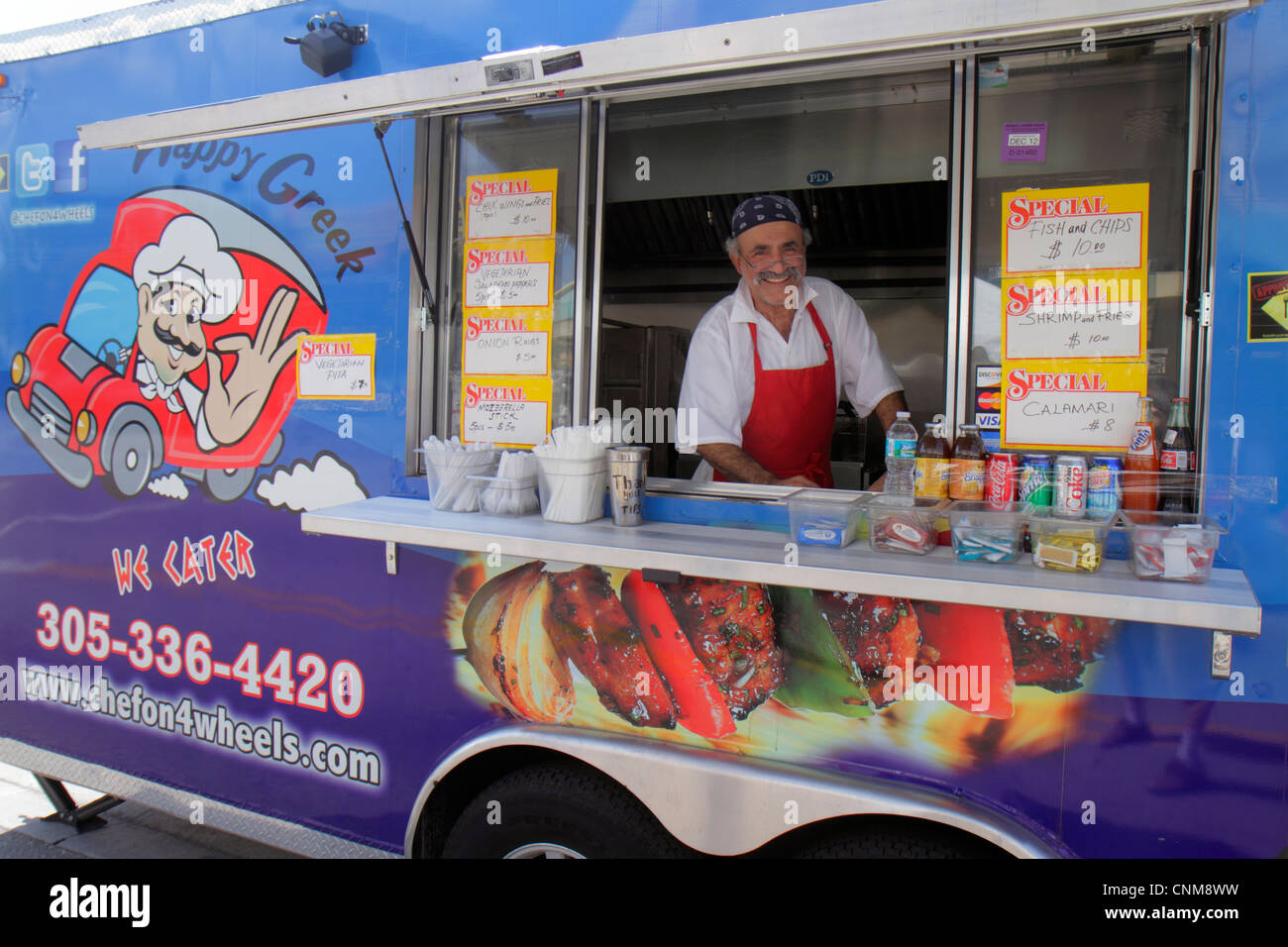 Miami Florida,Hialeah,Palm Avenue,Art on Palm,fair,festival,food truck,Greek,man men male adult adults,food,mobile small business,owner,smiling,happy, Stock Photo