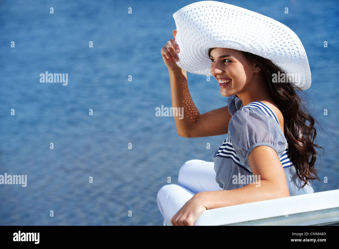 Portrait of pretty young lady in hat by the seaside Stock Photo - Alamy