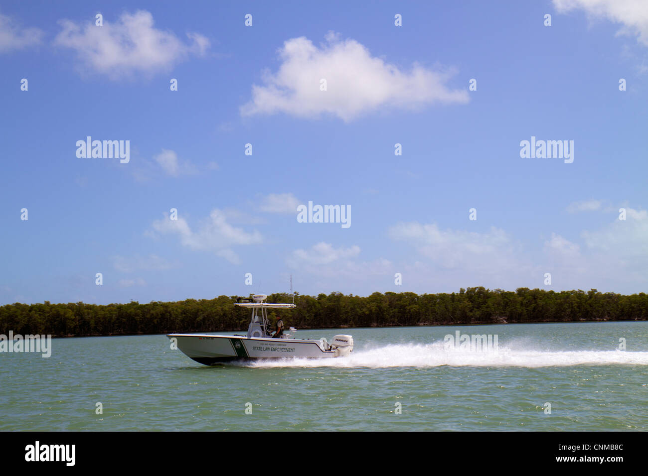 Florida Upper Key Largo Florida Keys,Blackwater Sound,Florida Bay water,Fish and Wildlife Commission State Law Enforcement,boat,officer,patrol,visitor Stock Photo