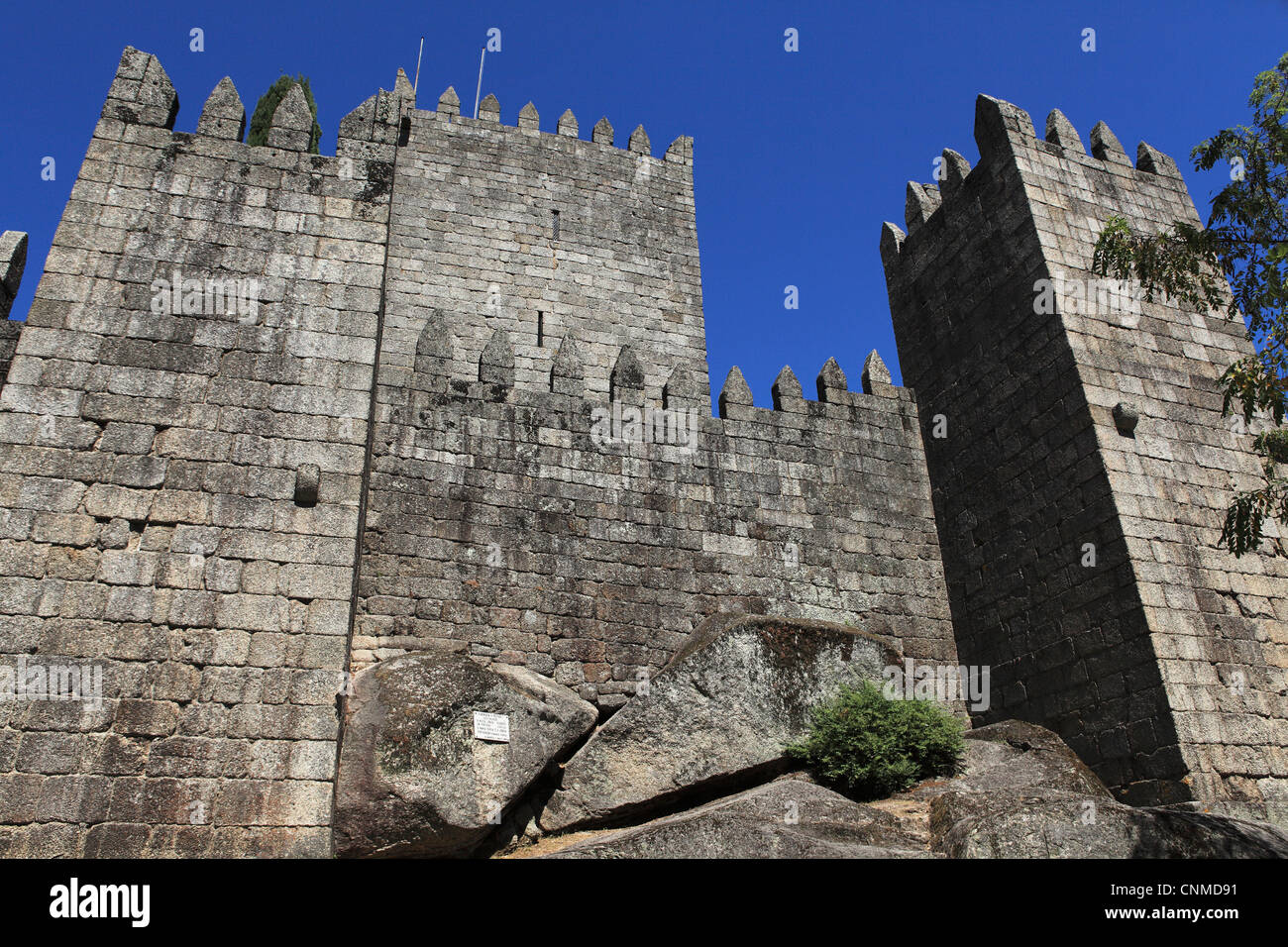 The walls of the castle (Castelo de Guimaraes) which overlooks the city of Guimaraes, Minho, Portugal, Europe Stock Photo