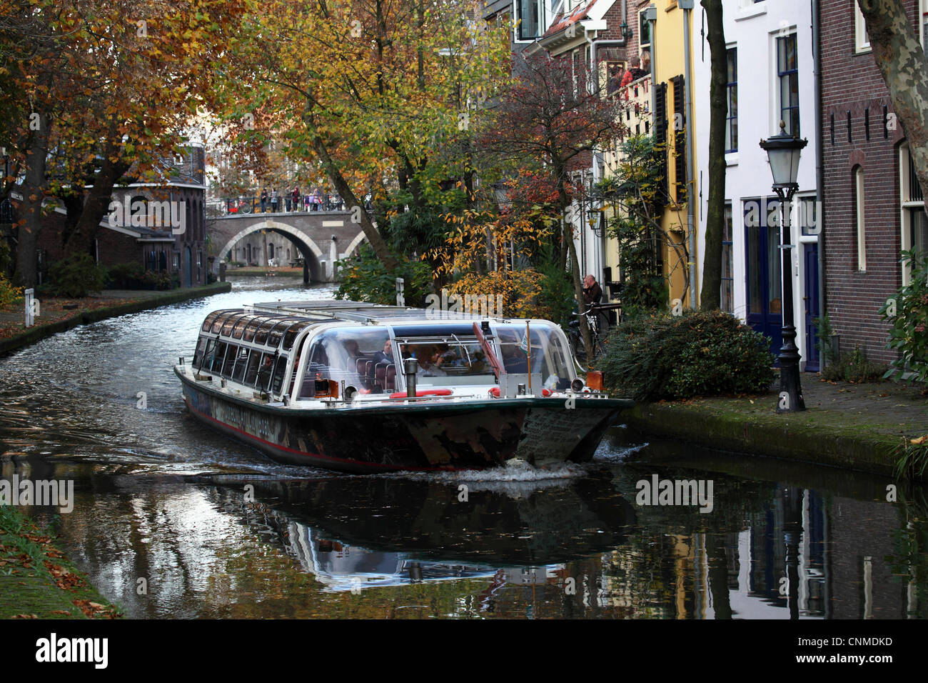 A sightseeing barge tours along the Oudegracht Canal in the Dutch city of Utrecht, Utrecht Province, Netherlands, Europe Stock Photo