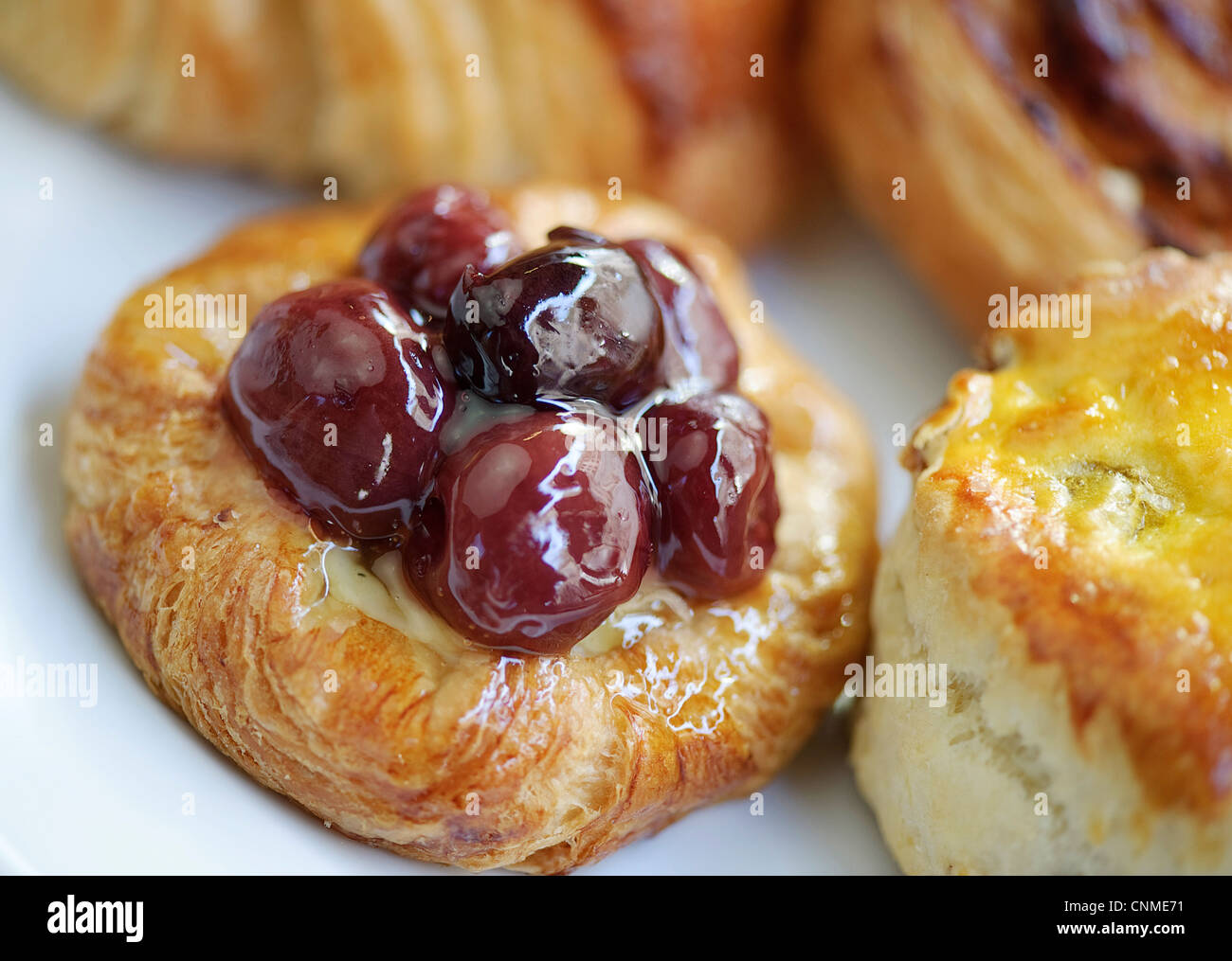 cherry fruit danish pastries cakes scone jam coffee afternoon tea treat Stock Photo
