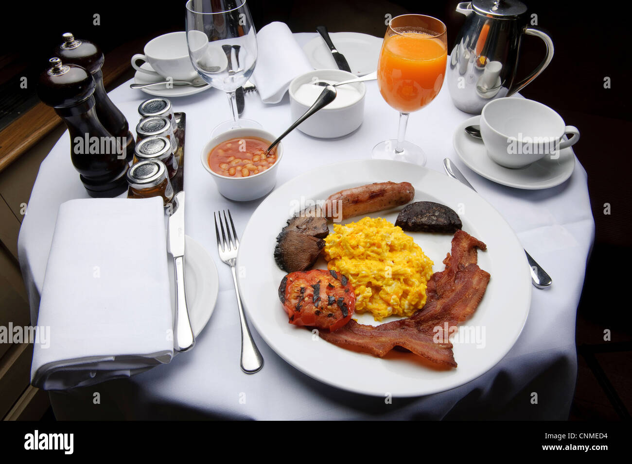 full english breakfast bacon and eggs fry-up in posh restaurant healthy unhealthy Stock Photo