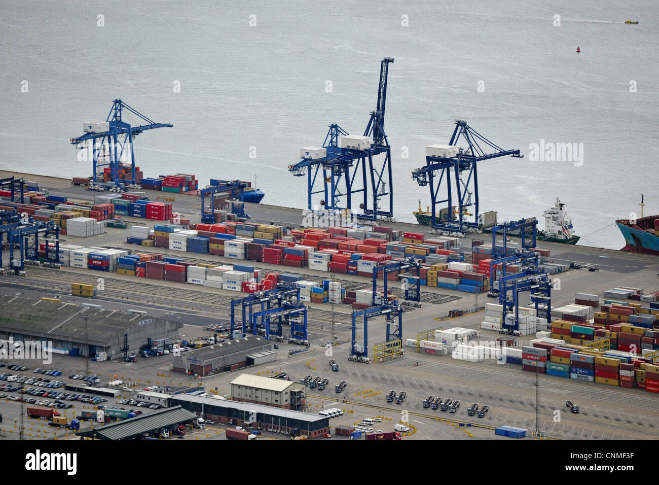 Aerial Photograph of Felixstowe Docks with Shipping containers, cranes, and ships in dock. Stock Photo