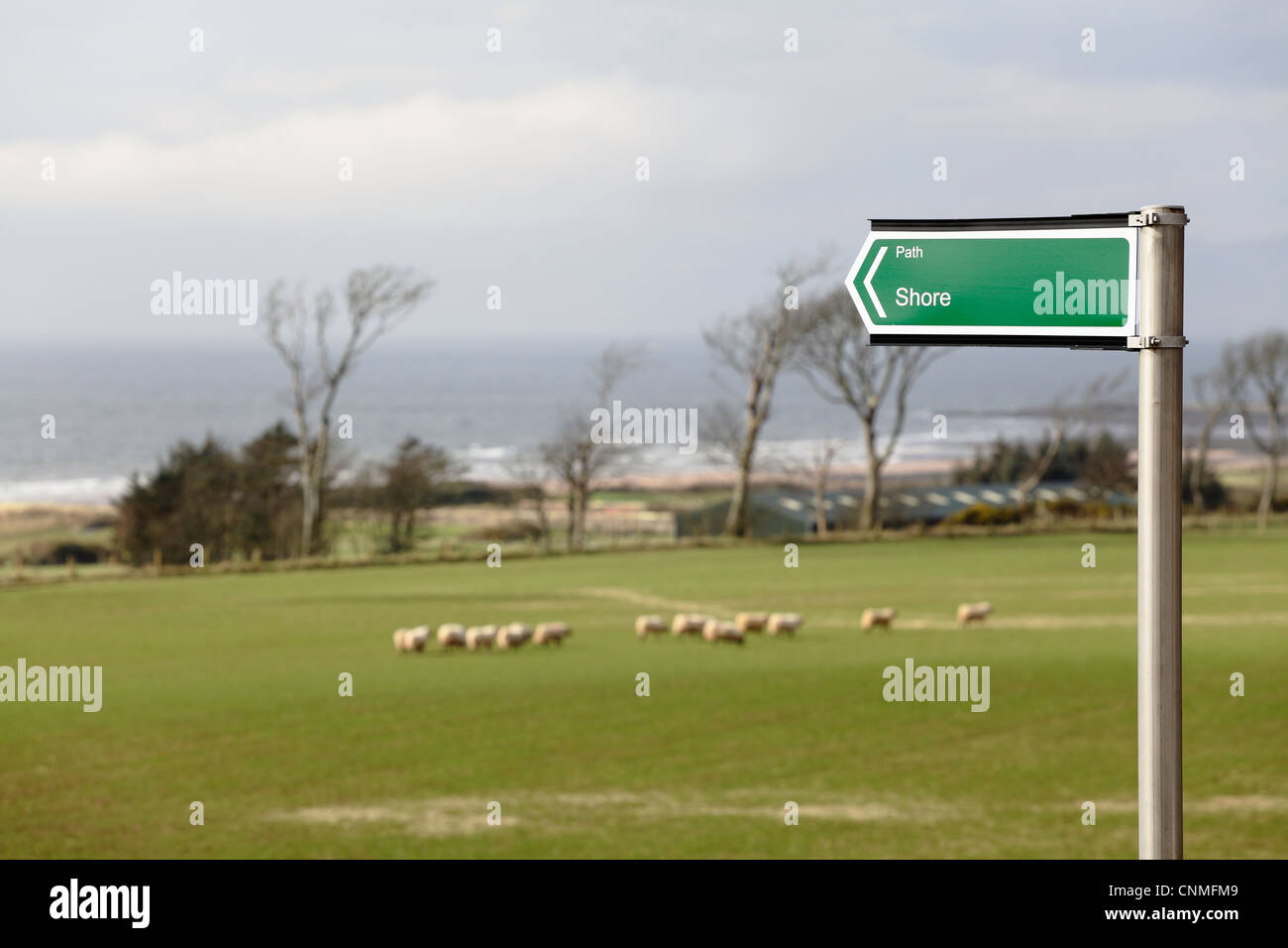 Direction sign pointing to a shore path between Portencross and West Kilbride beside the Firth of Clyde in North Ayrshire, Scotland, UK Stock Photo