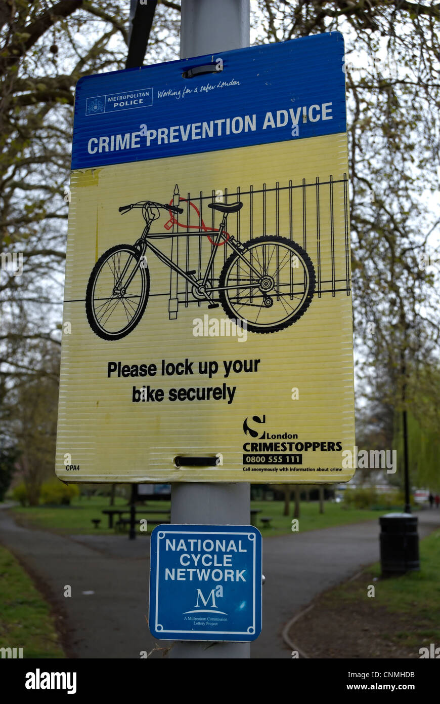 crime prevention sign warning cyclists to lock their bikes securely, in kingston, surrey, england Stock Photo