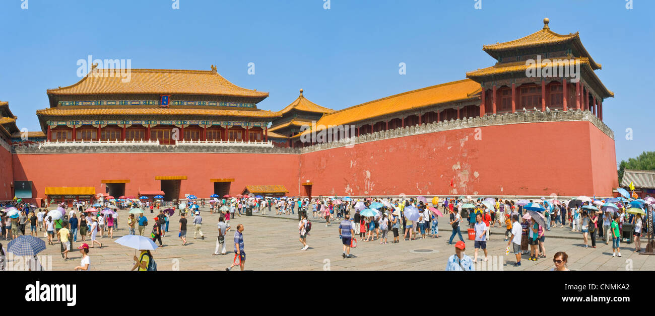 A 2 picture stitch panoramic of crowds of tourists on their way through the Meridian Gate, the entrance to The Forbidden City. Stock Photo