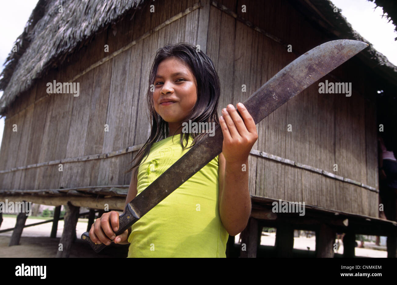 Young girl with machete. Chobayacu river, Loreto Province, Peru Stock