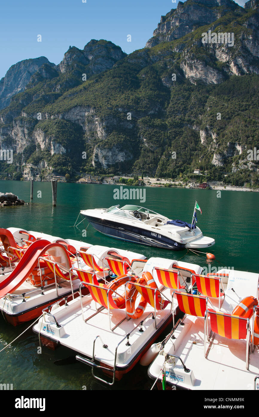 Speed boat and pedalos on Lake Garda, Italy Stock Photo