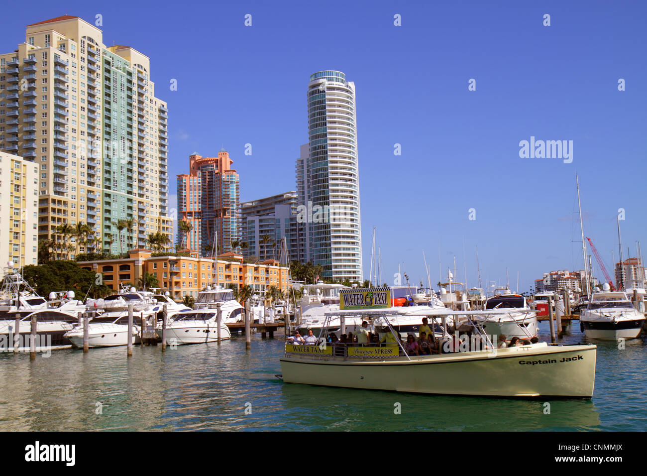Miami Beach Florida,Biscayne Bay,Miami Beach,Marina,high rise,condominium buildings,city skyline,Yacht Club,Murano,Portofino,Biscayne Xpress Water tax Stock Photo