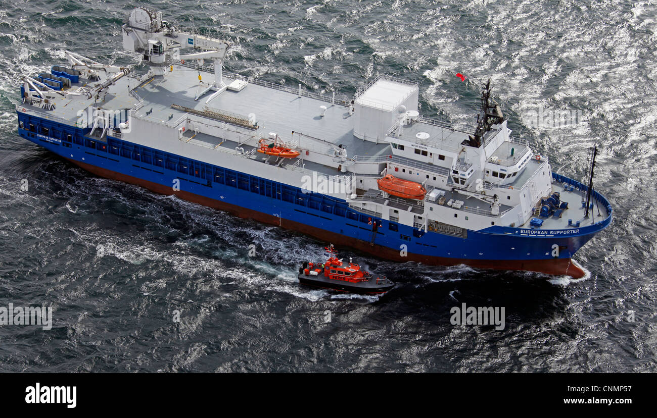 aerial view of a ship with pilot boat escort in the North Sea Stock Photo