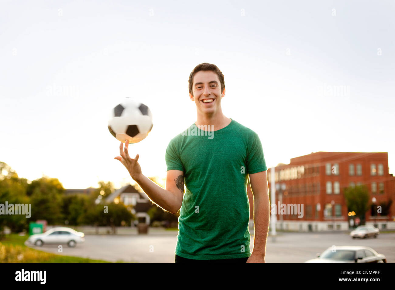 Man spinning soccer ball on finger Stock Photo Alamy