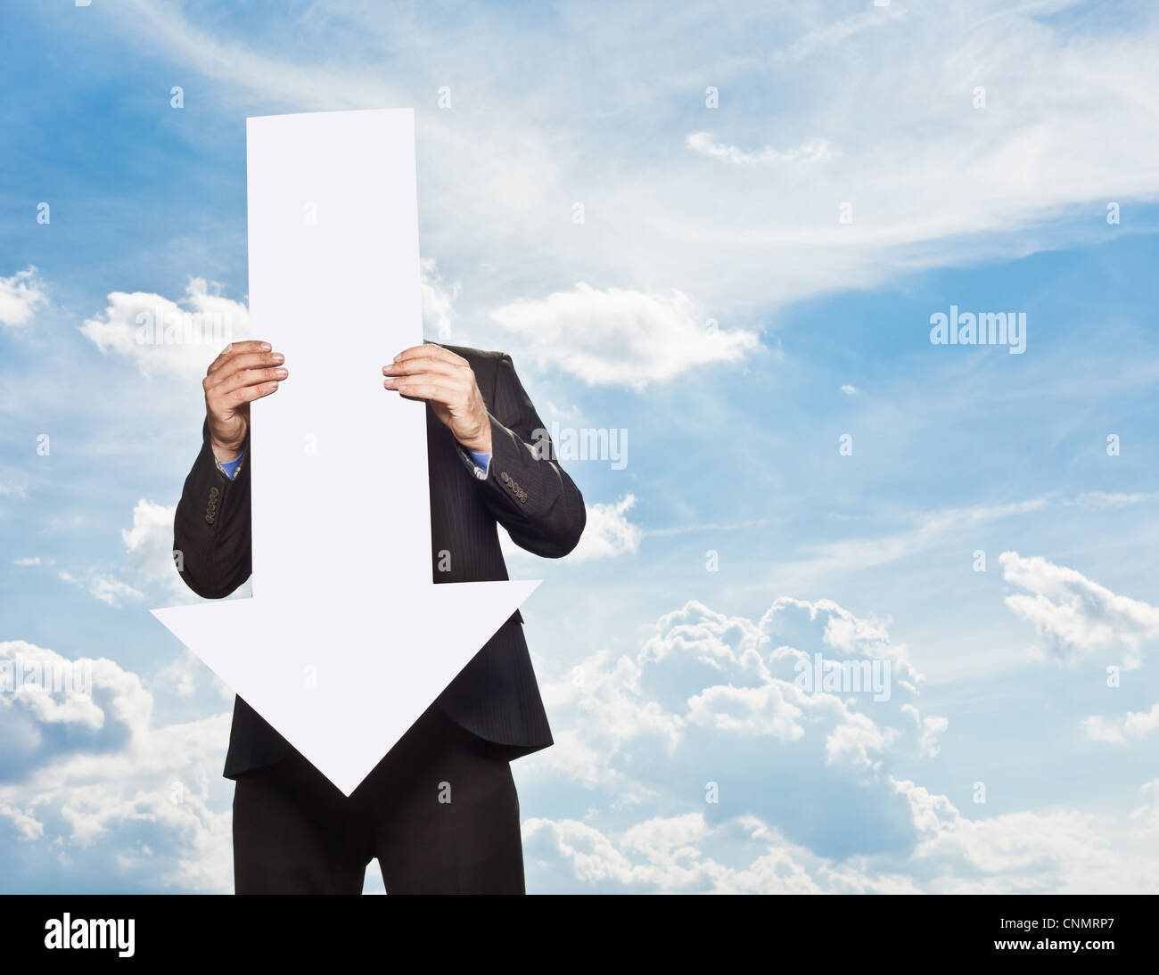 Businessman holding blank arrow Stock Photo