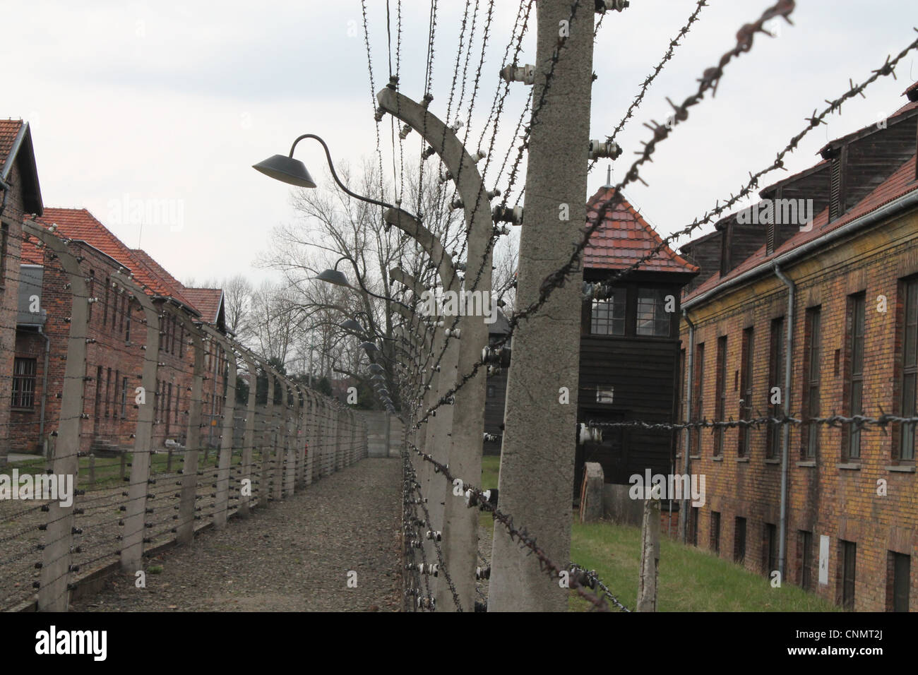 Two Barbed Wire Electric fences inside Auschwitz Concentration Camp. Stock Photo
