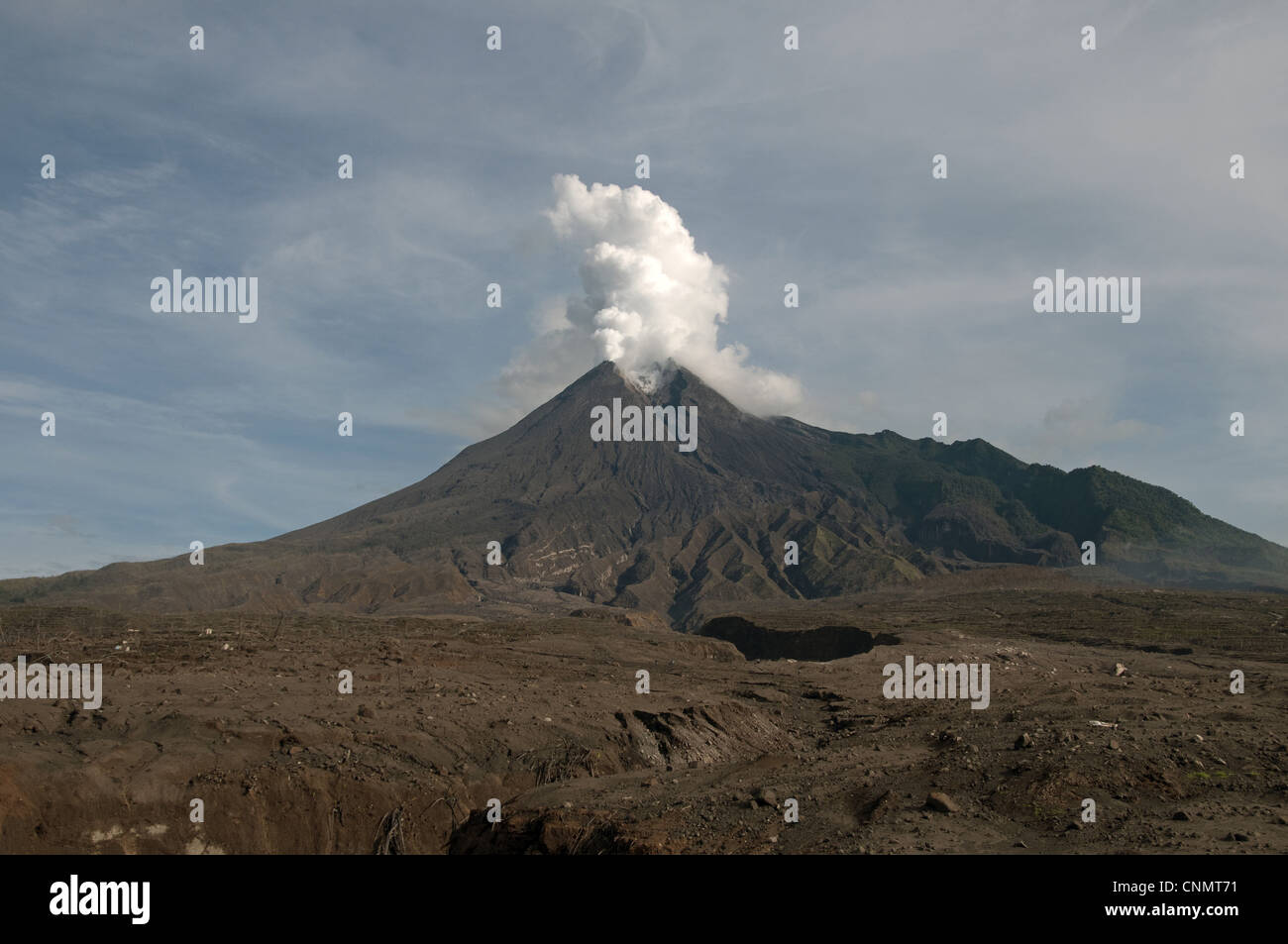 Recently erupted volcano with ash plumes, Mount Merapi, Central Java, Indonesia, december 2010 Stock Photo