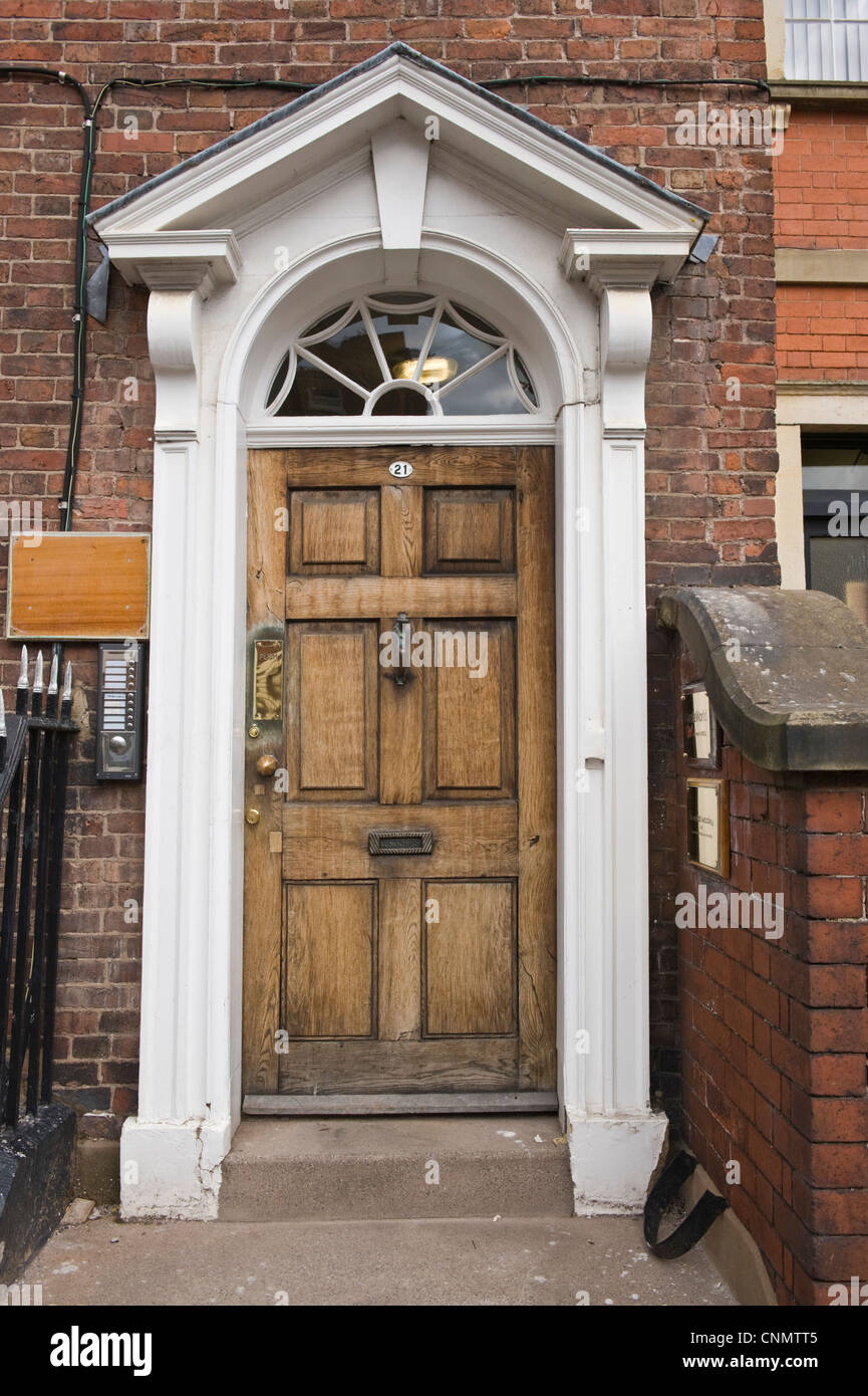 Front door No 21 brown wooden Georgian Hereford Herefordshire England UK Stock Photo