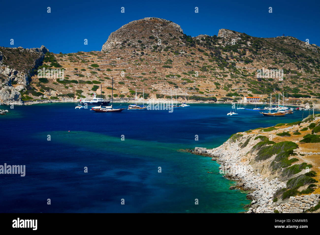 Bay and sailing ships in Knidos ancient Greek city ruins. Datca