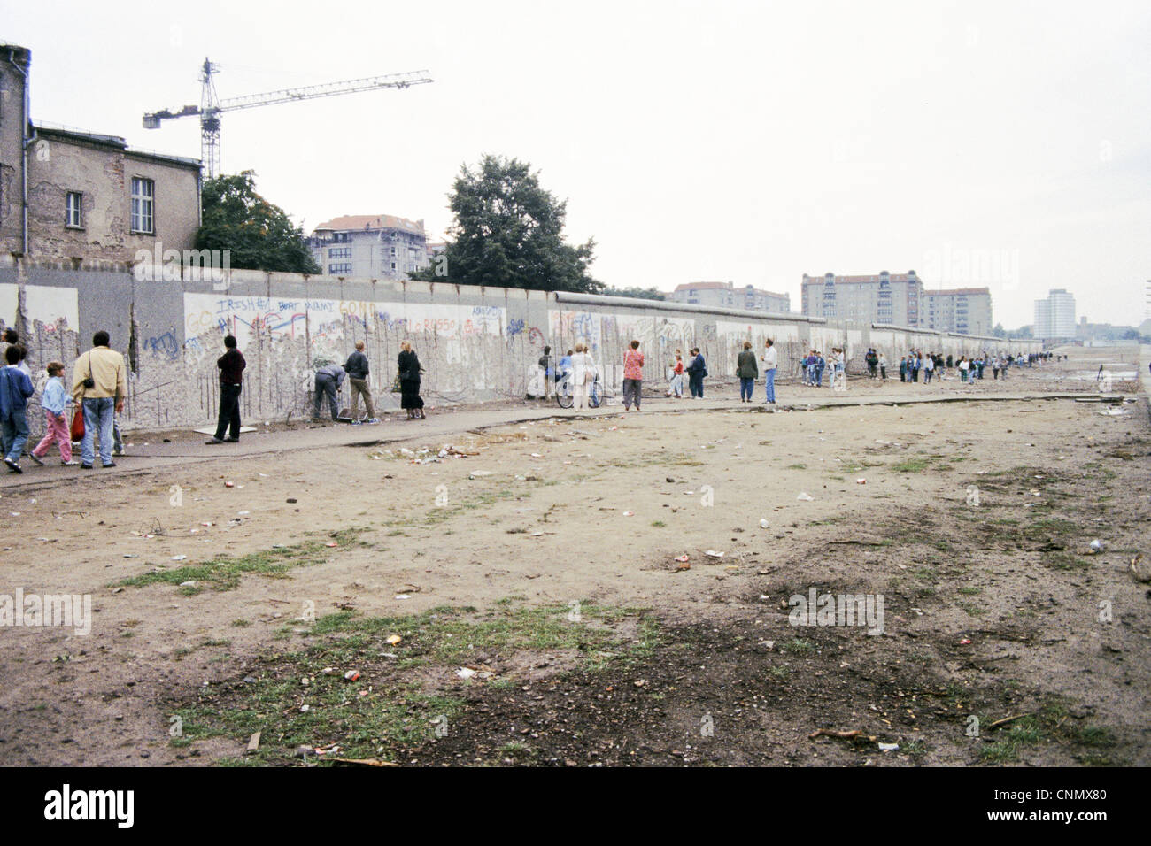 The Berlin Wall at the Brandenburg Gate in 1990 collecting souvenirs