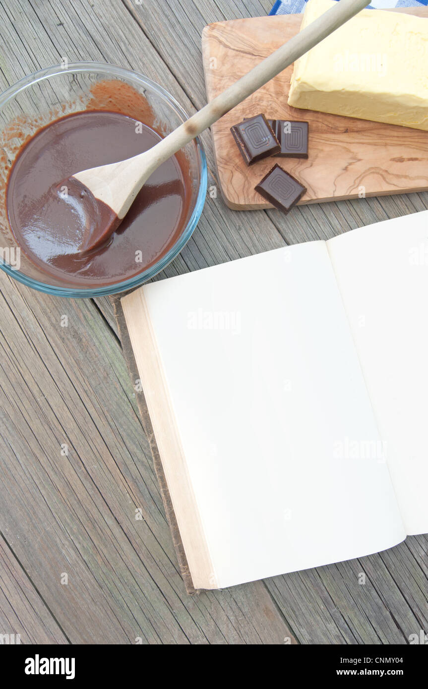 Blank recipe book surrounded with ingredients including hot chocolate Stock Photo