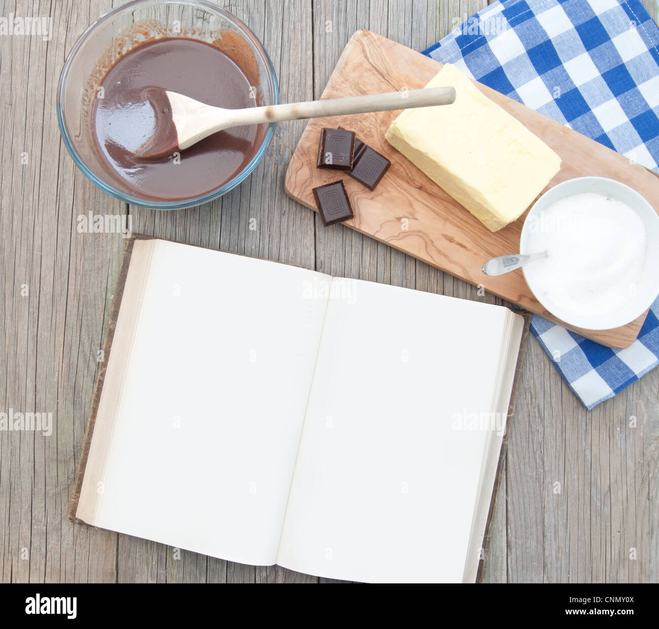 Blank recipe book surrounded with ingredients including hot chocolate Stock Photo