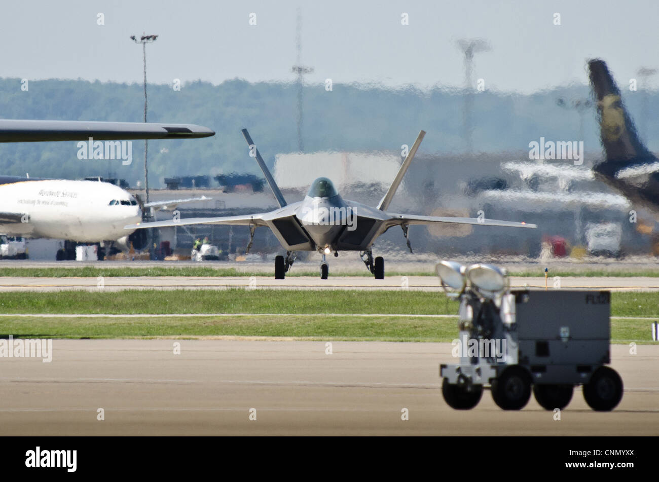 A U.S. Air Force F-22 Raptor aircraft taxies into the Kentucky Air National Guard Base in Louisville, Ky., on April 18, 2012, prior to this weekend’s 22nd annual Thunder Over Louisville air show. The Raptor is the U.S. military’s premier fighter aircraft, with capabilities that are unmatched by any other plane. Stock Photo