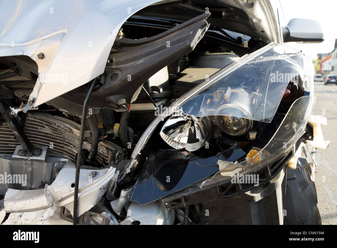 Broken Car after a Crash. Damaged Wing and Headlamp of a Car