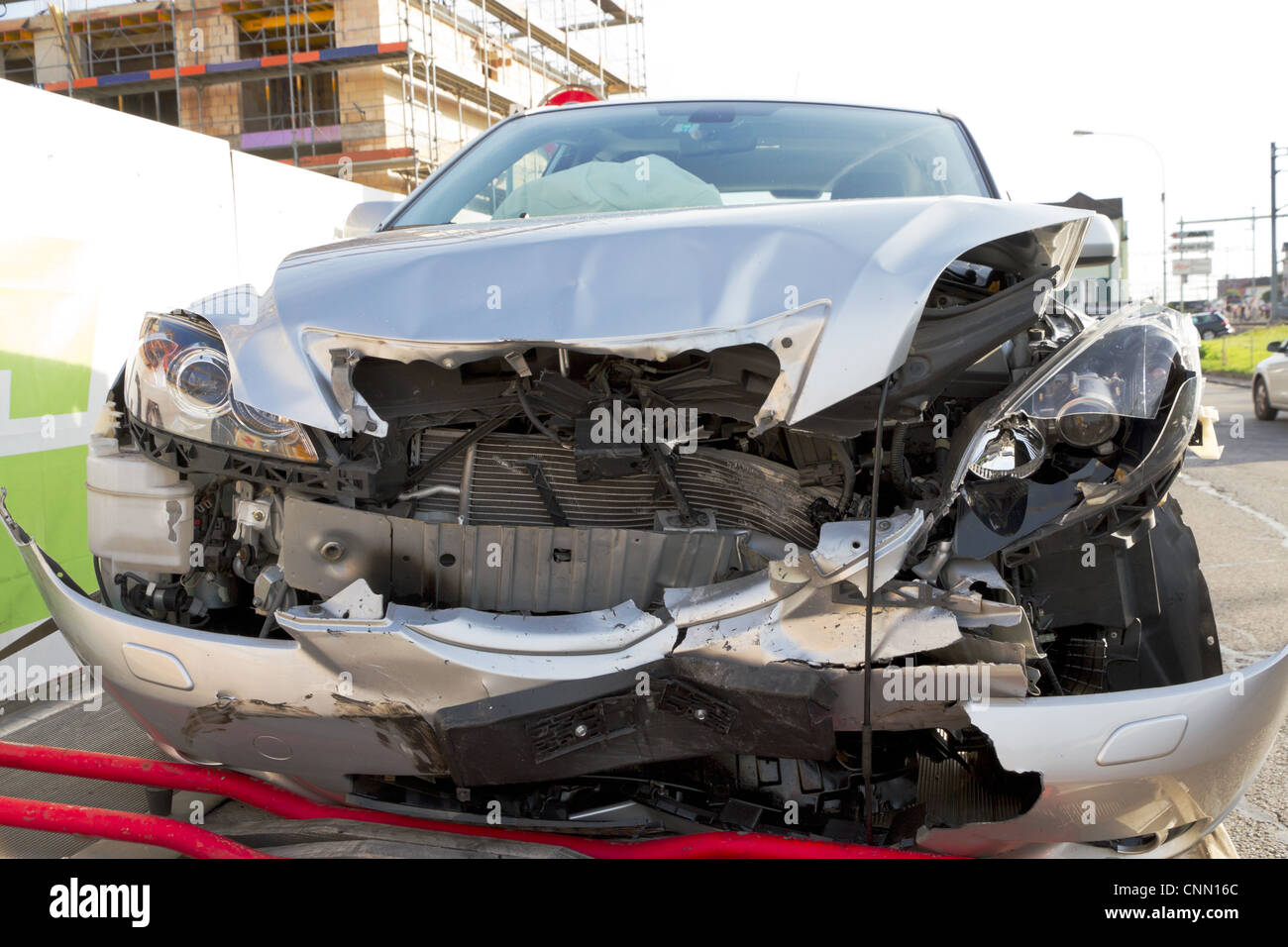 frontal car crash wreck with deployed airbags on trailer to be hauled ...