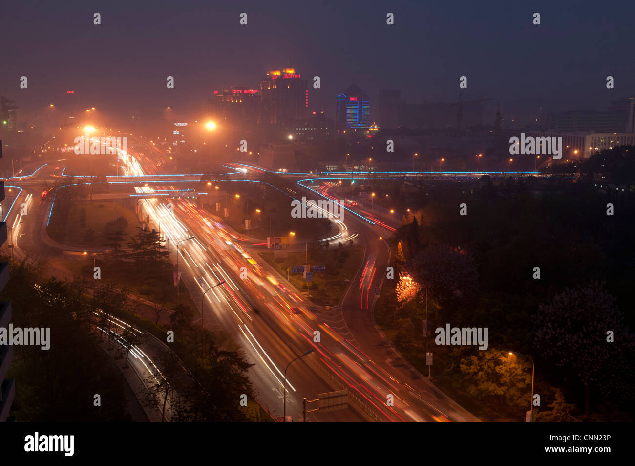 Evening sky  over a Beijing city centre intersection Stock Photo