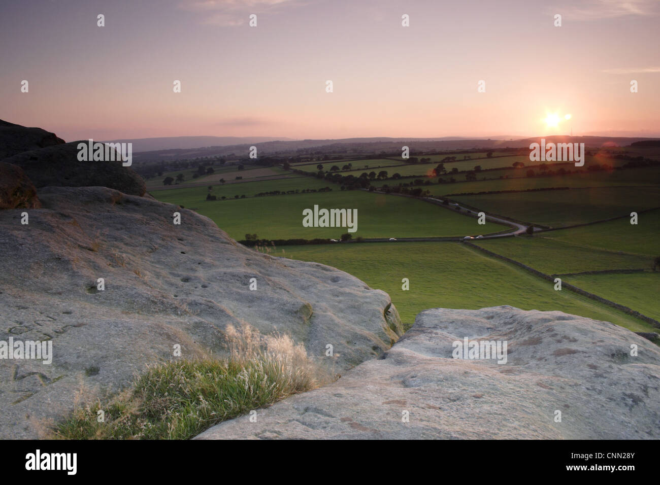 View over surrounding farmland from Almscliff Crag rock formation at sunset, North Rigton, North Yorkshire, England, august Stock Photo