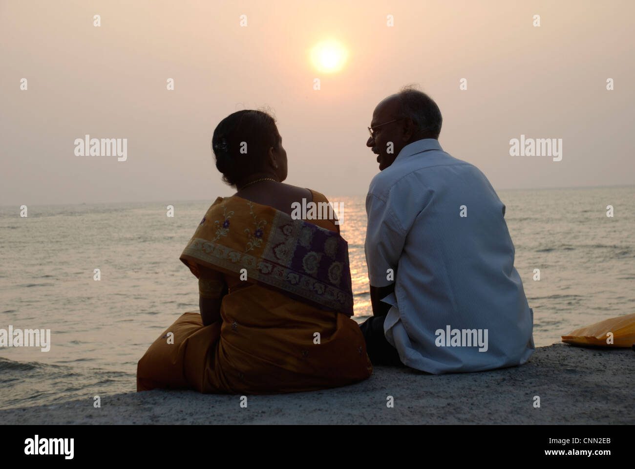 The sun sets over an elderly Indian couple in the port city of Fort Kochi in Kerala. Picture: Adam Alexander/Alamy Stock Photo