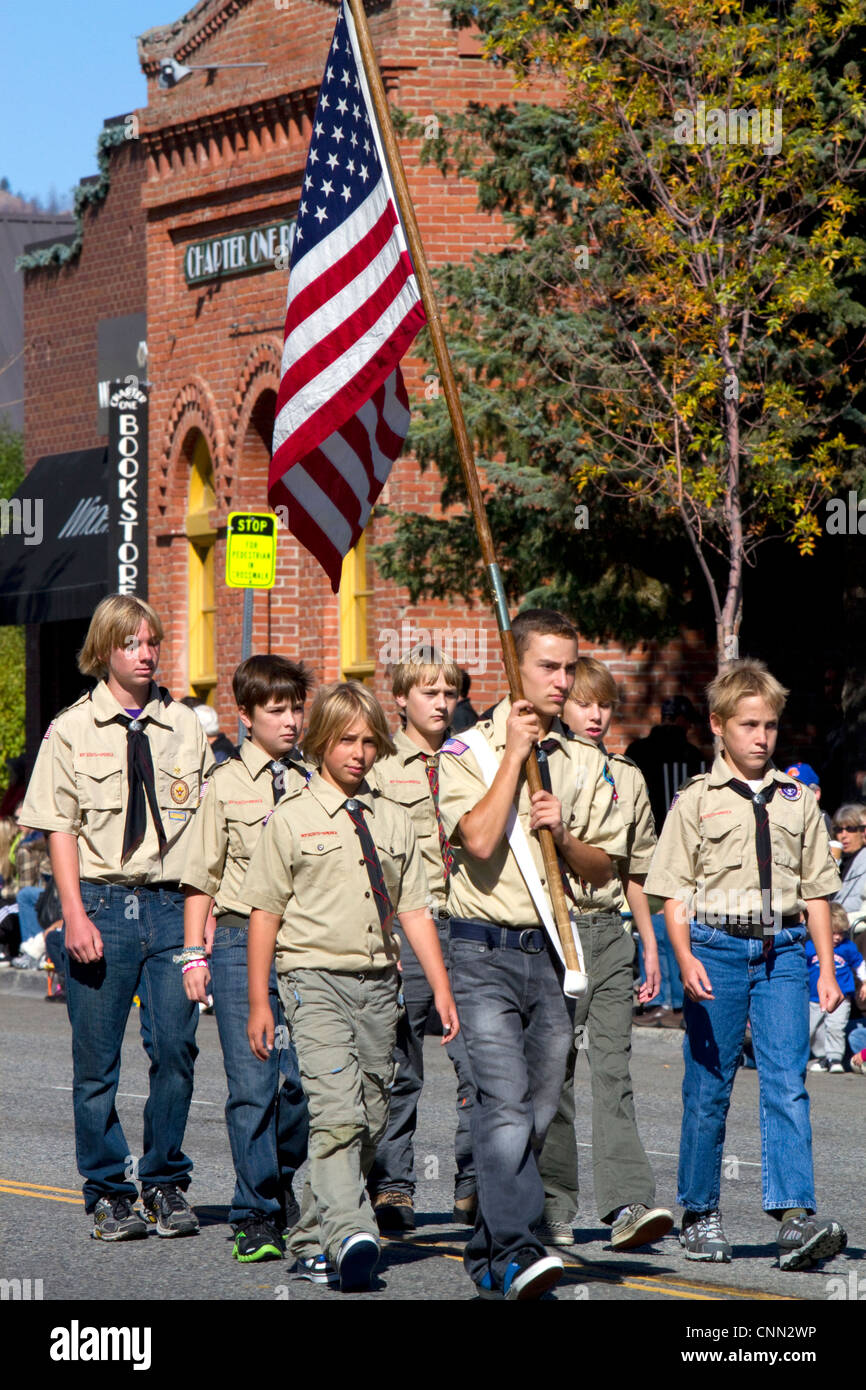 Boy Scout honor guard walking in the Trailing of the Sheep Parade on Main Street in Ketchum, Idaho, USA. Stock Photo