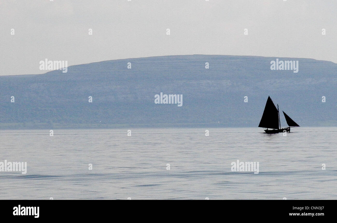 A traditional Galway Hooker boat sails in Galway Bay, Ireland Stock Photo